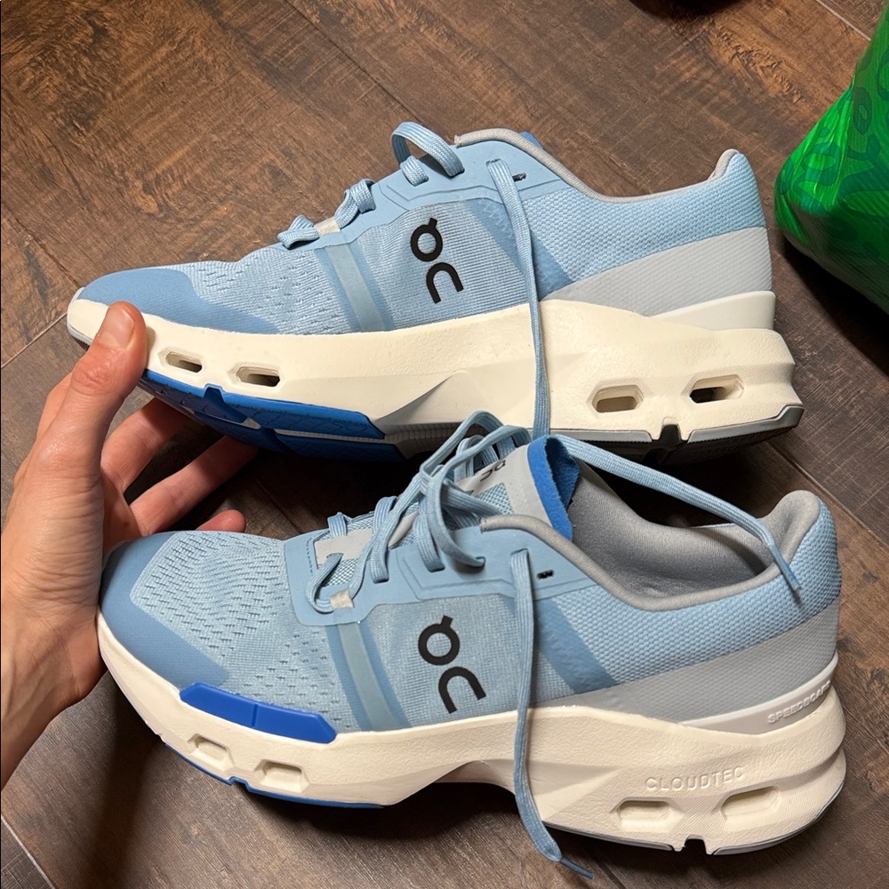 On Running Light Blue and White Athletic Shoes